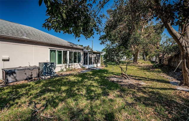 view of yard featuring a sunroom