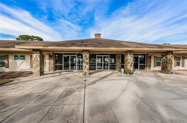 rear view of house featuring a patio