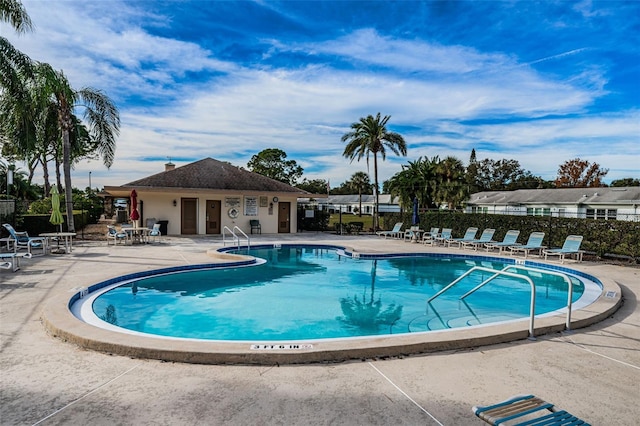 view of swimming pool with a patio