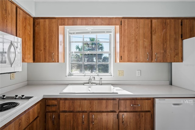 kitchen with white appliances and sink