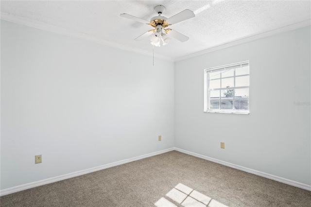 spare room with light carpet, crown molding, ceiling fan, and a textured ceiling