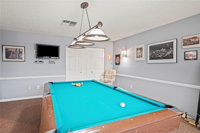 recreation room with carpet flooring, a textured ceiling, and pool table