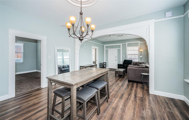 dining space with dark wood-type flooring