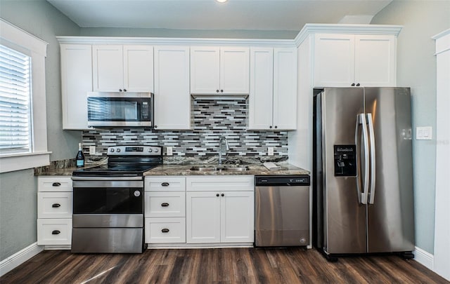 kitchen with sink, white cabinets, stainless steel appliances, and dark hardwood / wood-style flooring