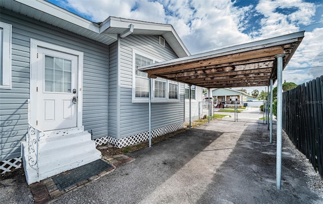 exterior space with a carport