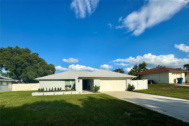 view of front of house featuring a front yard and a garage