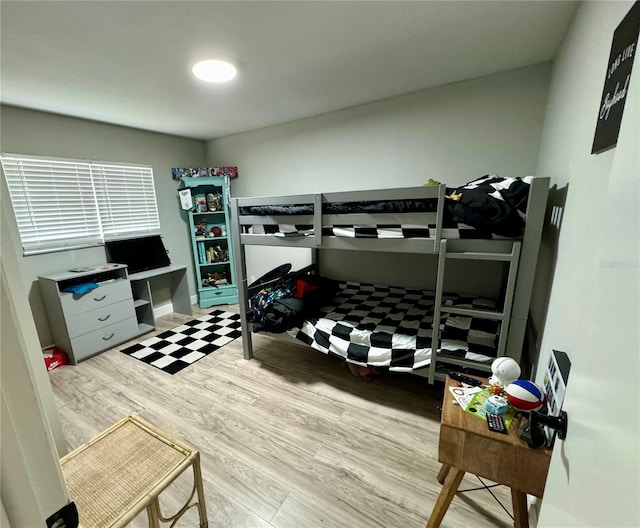 bedroom with hardwood / wood-style flooring