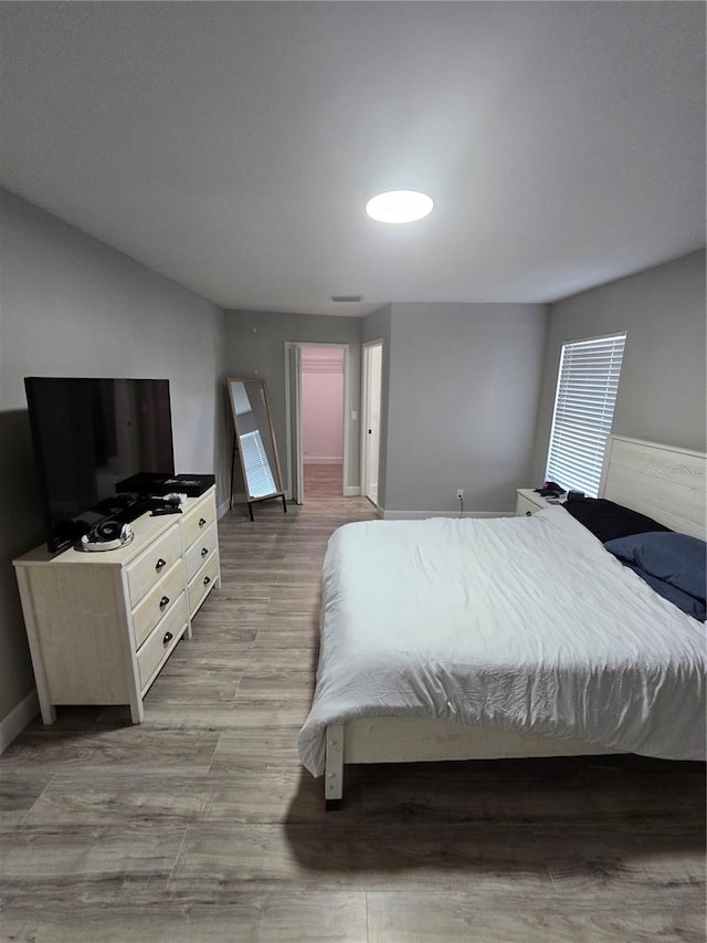 bedroom with light hardwood / wood-style floors