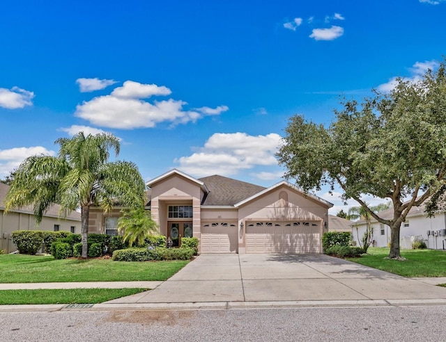 view of front facade featuring a front lawn and a garage