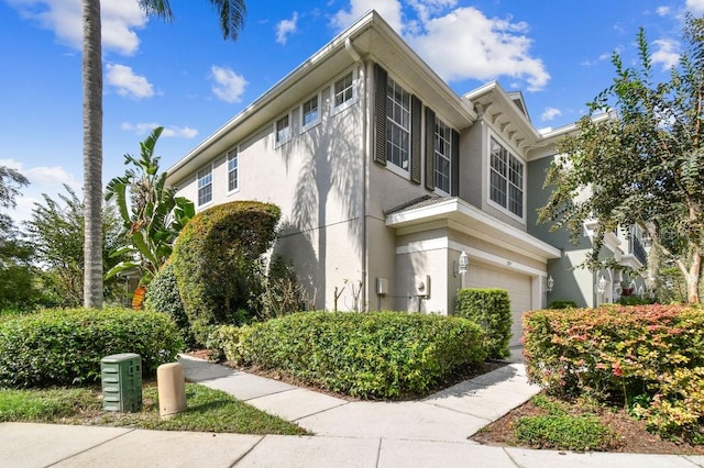 view of side of property with a garage