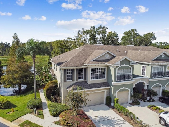 view of front of house with a balcony and a garage