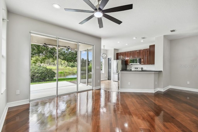 interior space featuring hardwood / wood-style floors and ceiling fan