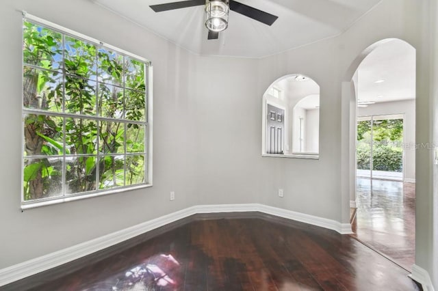 spare room featuring ceiling fan and hardwood / wood-style floors