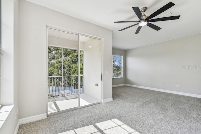 empty room with carpet floors and ceiling fan