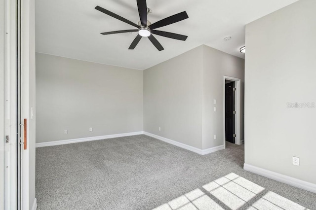 carpeted empty room with ceiling fan