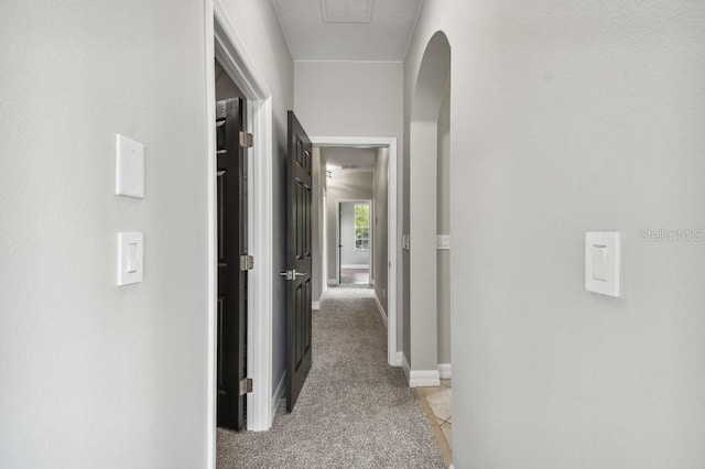 hallway with light carpet