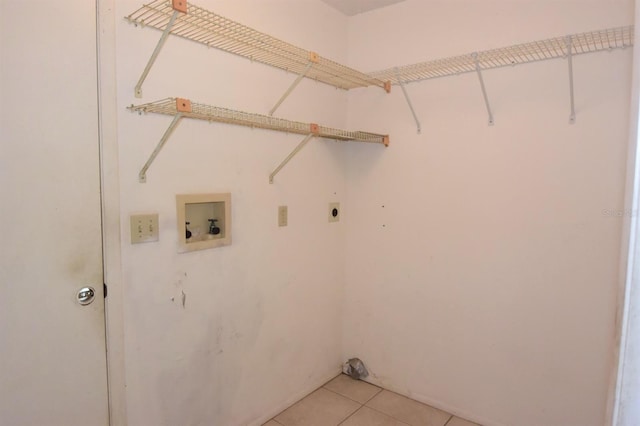 clothes washing area with hookup for a washing machine, light tile patterned floors, and electric dryer hookup