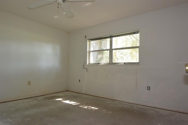 empty room featuring concrete floors and ceiling fan