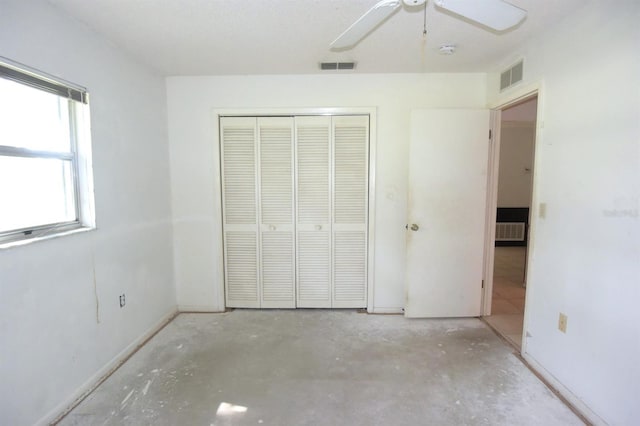 unfurnished bedroom with a closet and ceiling fan