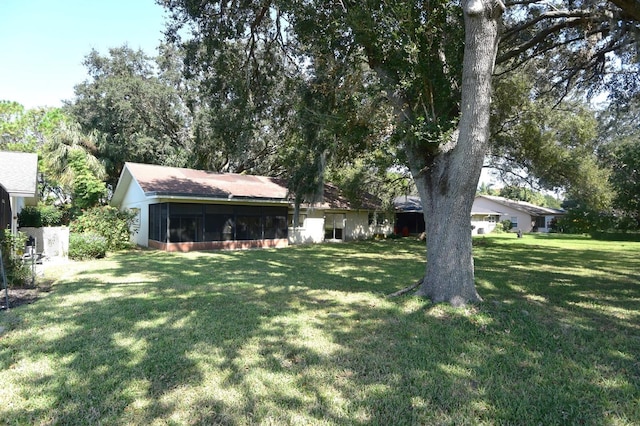 view of yard with a sunroom