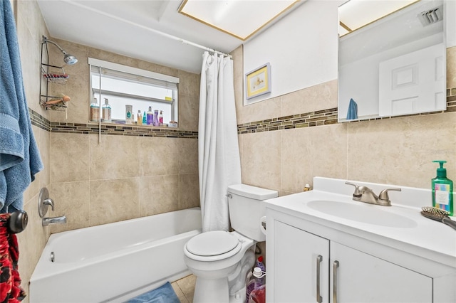 7240 Nova Scotia Dr, Port Richey, FL 34668 - full bathroom with tile walls, toilet, vanity, visible vents, and shower / bath combo