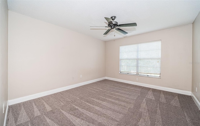 spare room featuring ceiling fan, a textured ceiling, and carpet floors