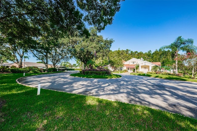 view of front facade with a front yard and a garage