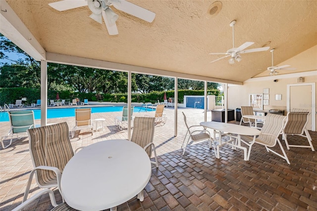 view of patio / terrace with a community pool and ceiling fan