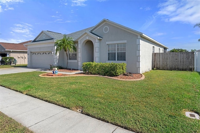 ranch-style home featuring a front lawn and a garage