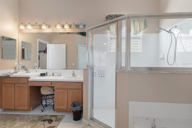 bathroom featuring vanity, shower with separate bathtub, and tile patterned flooring