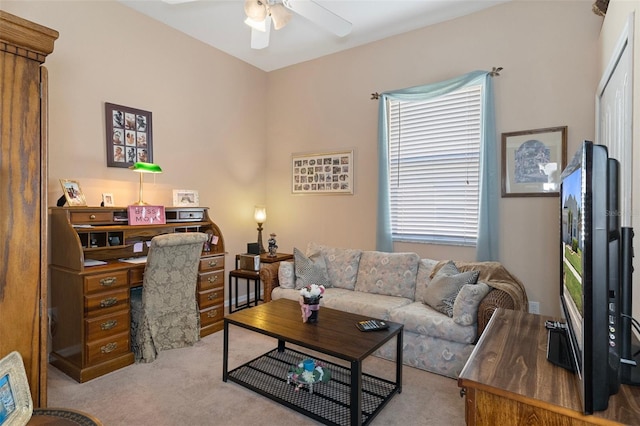 carpeted living room with ceiling fan