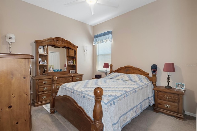 bedroom featuring light colored carpet and ceiling fan