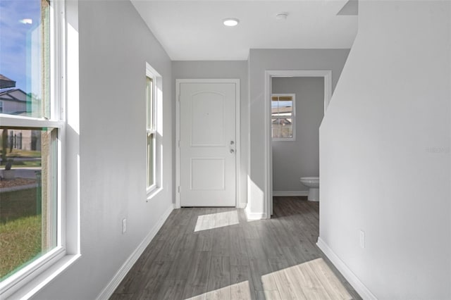 corridor with dark wood-type flooring