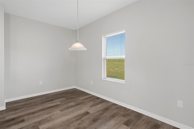 unfurnished room featuring dark hardwood / wood-style flooring