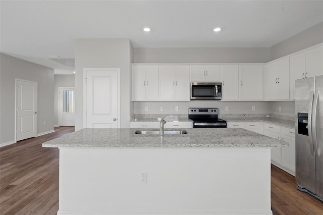 kitchen with white cabinets, sink, a kitchen island with sink, and appliances with stainless steel finishes