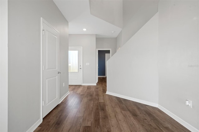 corridor with dark wood-type flooring