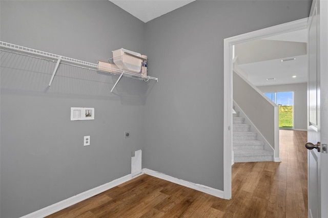 laundry room with hardwood / wood-style floors, hookup for an electric dryer, and washer hookup