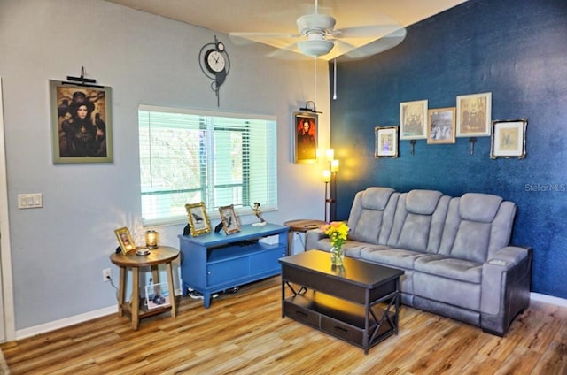 living area with wood finished floors, ceiling fan, and baseboards