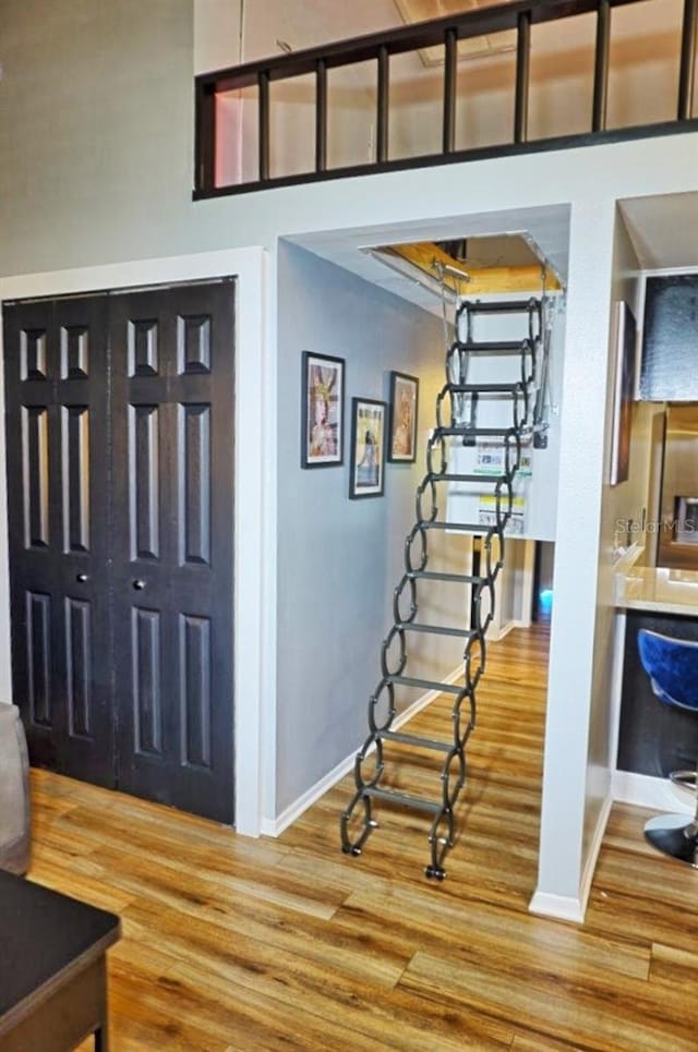 entrance foyer featuring light wood-type flooring and baseboards