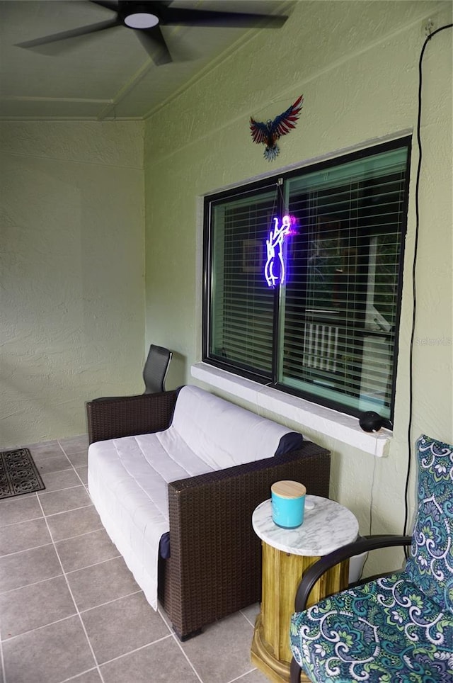 exterior space featuring ceiling fan