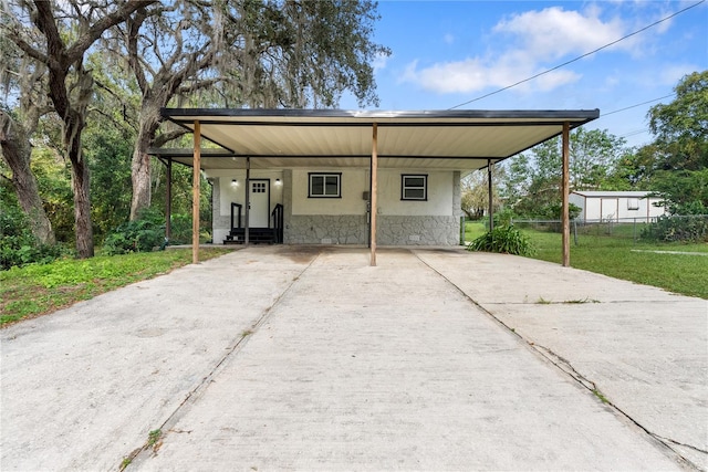 exterior space with a yard and a carport