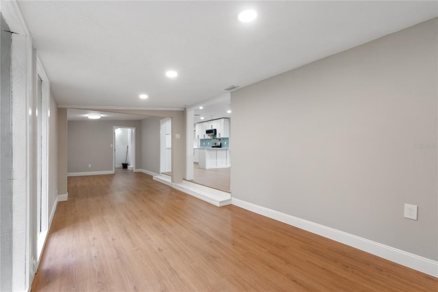 unfurnished living room featuring light wood-type flooring