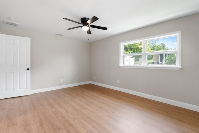 unfurnished room featuring light hardwood / wood-style floors and ceiling fan