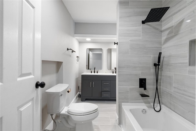 full bathroom featuring vanity, tiled shower / bath combo, and toilet