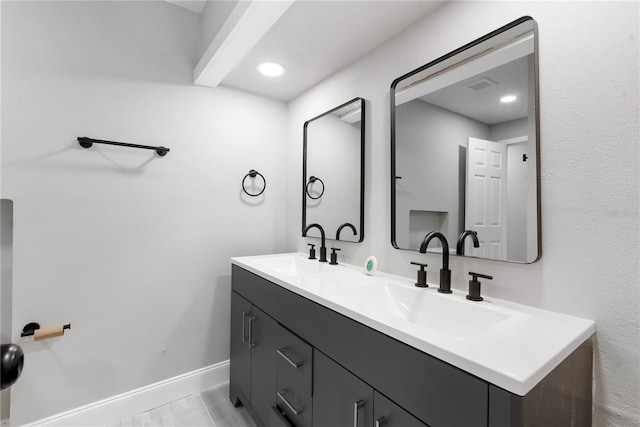 bathroom with vanity and tile patterned floors