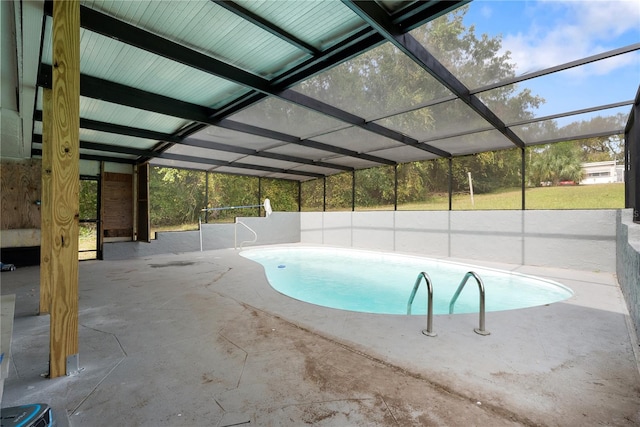 view of swimming pool with a patio and glass enclosure