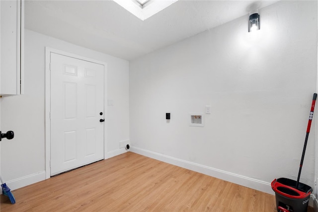 laundry room with hookup for a washing machine and light hardwood / wood-style flooring