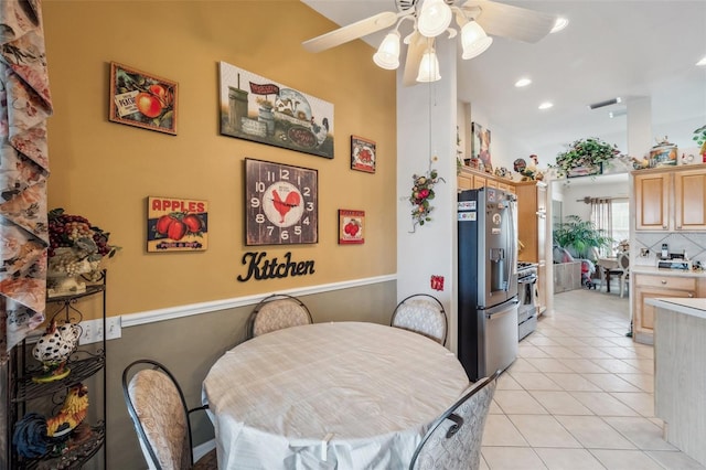 tiled dining area featuring ceiling fan