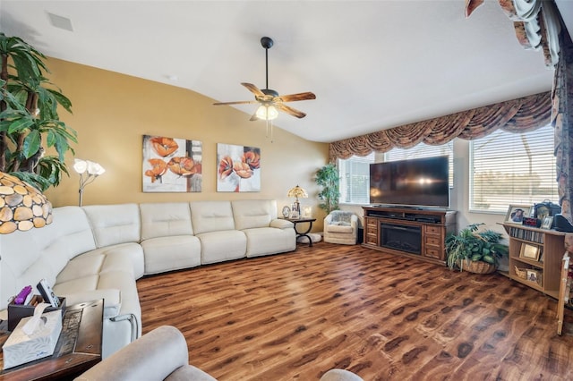 living room with ceiling fan, vaulted ceiling, and dark hardwood / wood-style flooring