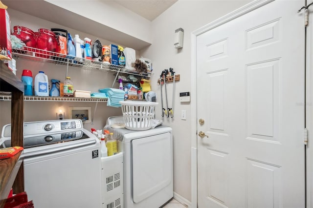 washroom with washer and dryer